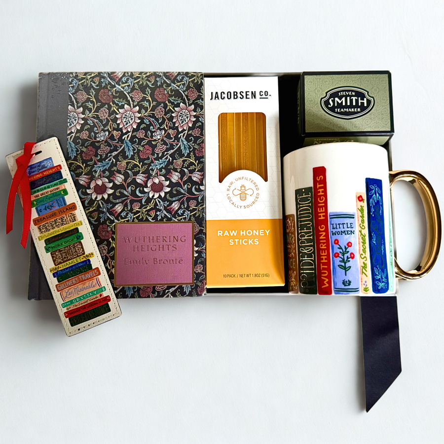 Collection of books, a mug, honey sticks, tea, and a bookmark on a white background