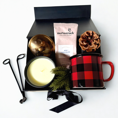 Cozy Fireside Gift Box with candle, plaid mug, wick trimmer, and hot chocolate packet.