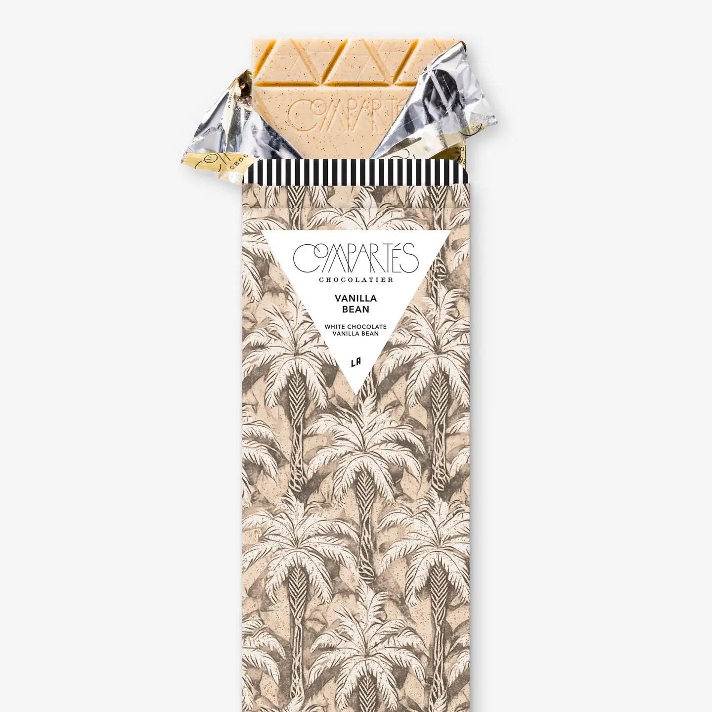 White chocolate vanilla bean bar with palm leaf pattern packaging on a white background by Compartés