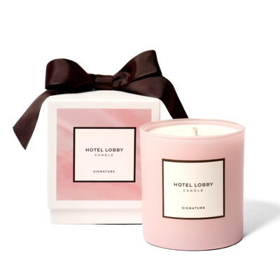 Pink candle with a brown bow and 'Hotel Lobby' label on a white background