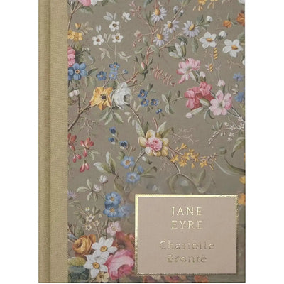 Floral-patterned book with 'Jane Eyre' by Charlotte Bronte on a beige background