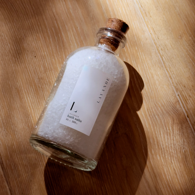 Bottle of lavender bath salts with a cork lid by Lavande