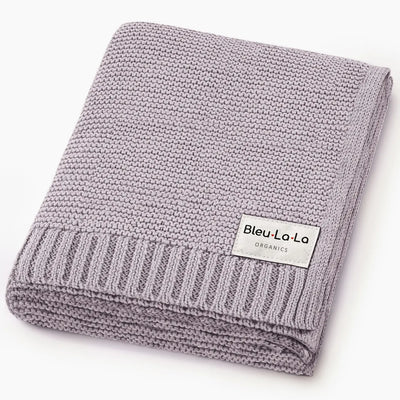 Folded knit blanket with 'Bleu La La Organics' label on a white background