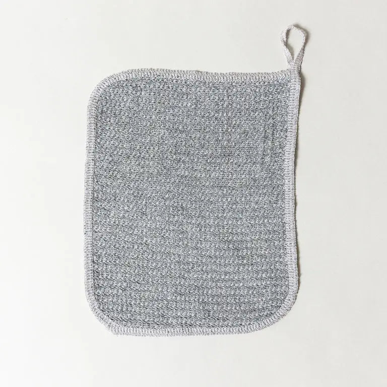 Gray textured binchotan towel on a light gray background