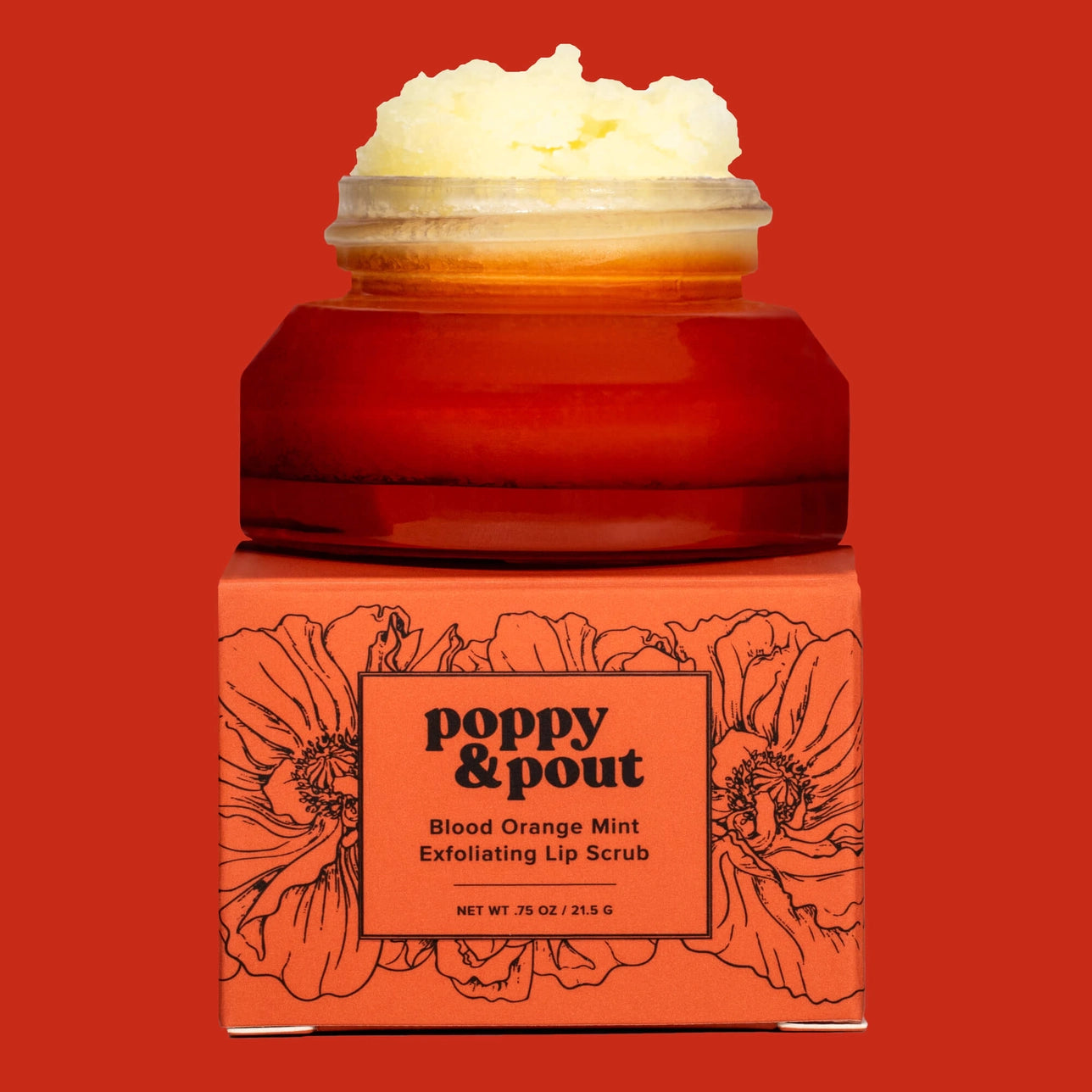 Poppy & Pout lip scrub jar with red packaging and floral design on a red background, blood orange mint exfoliating lip scrub