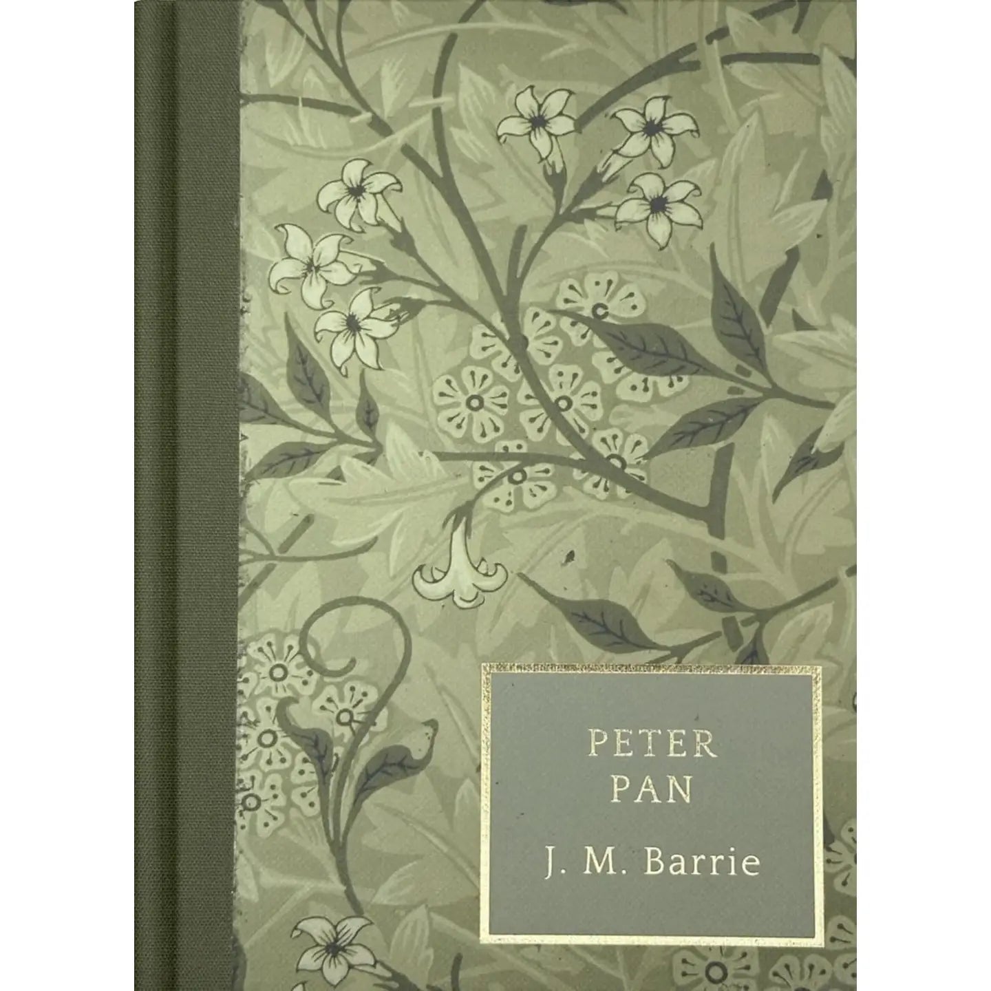 Book cover of 'Peter Pan' by J. M. Barrie with floral design